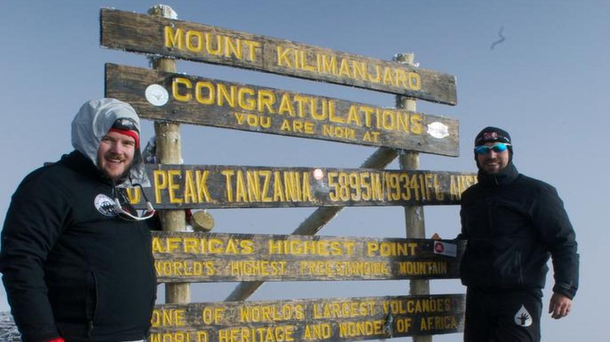 John Kelley (left) worship and executive minister at Catalyst Christian Church in Nicholasville, celebrates his climb to the top of 19,341-foot Mount Kilimanjaro with his longtime friend Daren Wendell of Canton, Ohio, who organized the climb. Lifewater International organized a fund raising climb up Mount Kilimanjaro to raise funds for the organization’s water project benefiting remote communities in neighboring Ethiopia. The group raised $103,000.