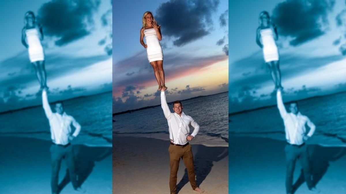 Adam Sunderhaus and Ashley Vennetti perform a “cupie” to celebrate their engagement on June 28. The two, both former UK cheerleaders, perform the stunt for photos in various locations they visit and may do it for their wedding as well. Photo illustration by Brian Simms.