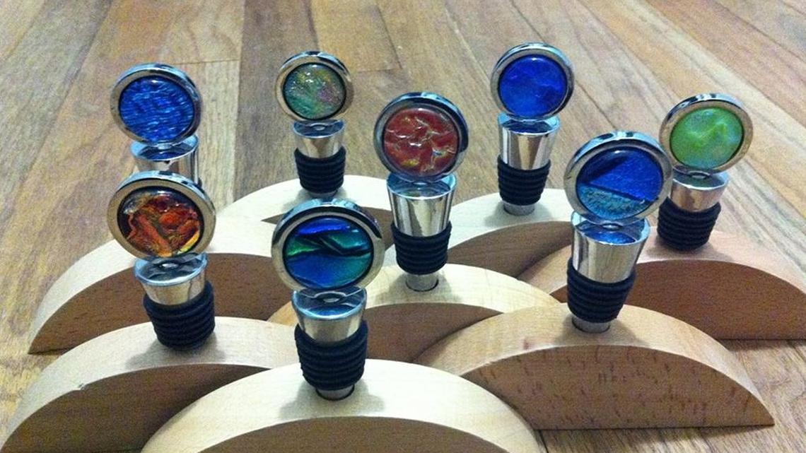 Jennifer Lackey Moore created these glass-and-metal wine stoppers, $25 for the stopper, $5 for the wood holder. Moore will be among the vendors at the Christmas Market at Michler’s.