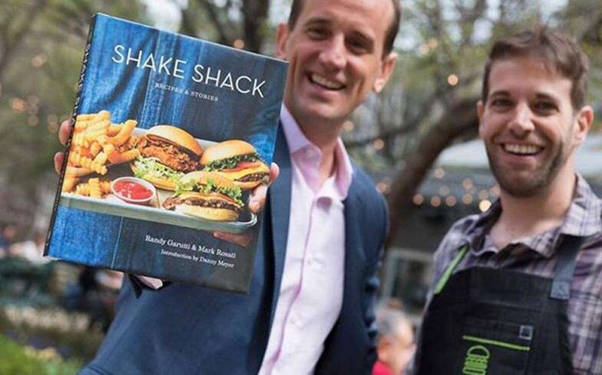 Randy Garutti, CEO, and Mark Rosati, culinary director, wrote “Shake Shack: Recipes & Stories.”