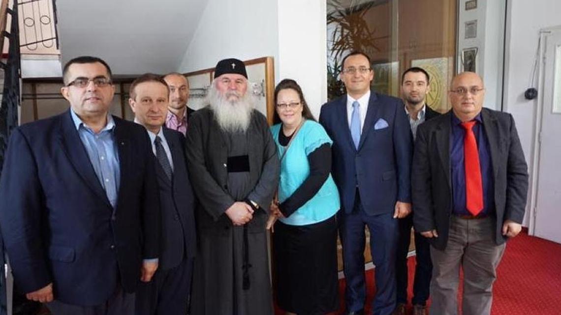 Rowan County clerk Kim Davis, center, is in Romania campaigning for an anti-gay marriage referendum.