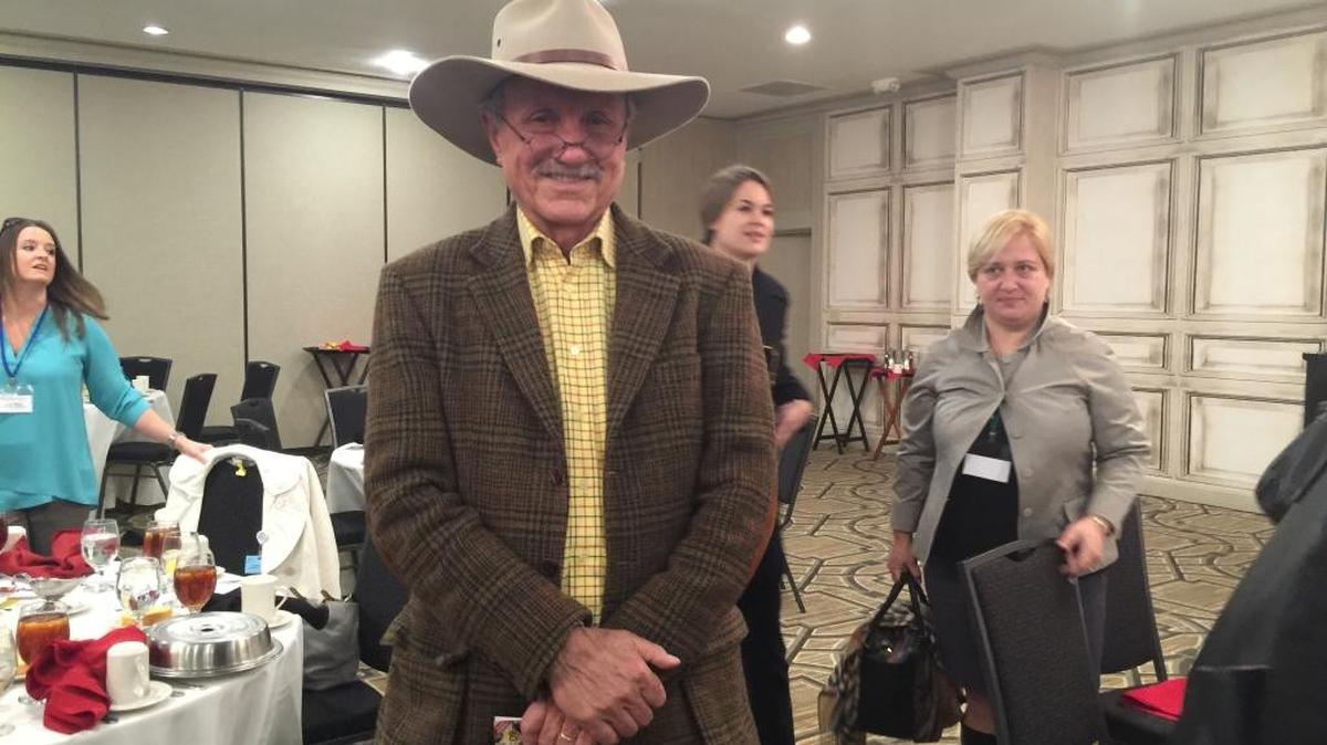 John Peterman spoke at the Professional Women’s Forum on Dec. 7. He wore an Akubra felt hat from Australia, J. Peterman plaid hunting jacket with suede elbow patches, available next year, and a Tattersall check shirt.