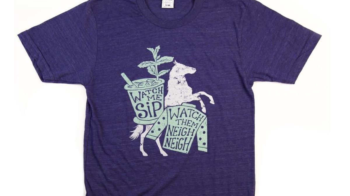 Kentucky for Kentucky has you covered for Derby with the ‘Watch Me Sip Watch Me Neigh Neigh’ shirt designed by Rachael Sinclair.