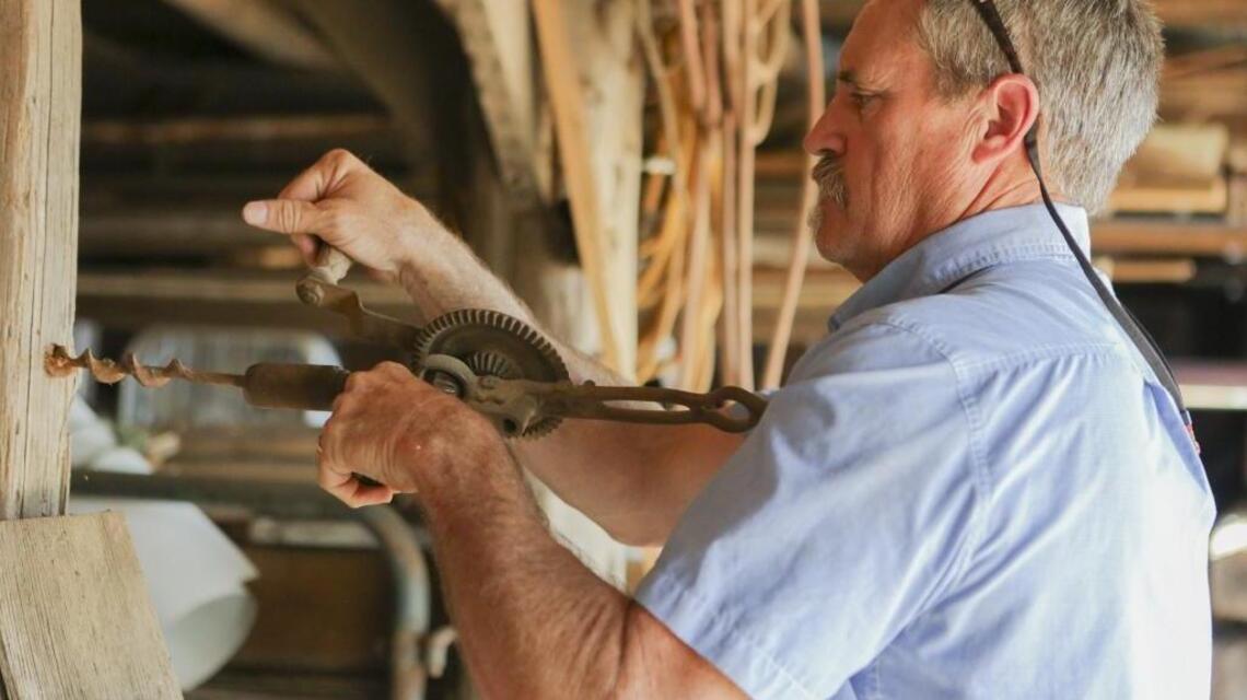 Work of early settlers is being saved by a man who loves old log cabins