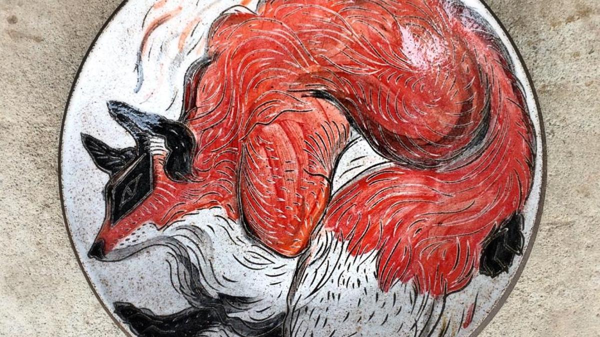 A colorful red fox adorns this stoneware dessert plate, $60, from Silver Run Ceramics. Shop this vendor and more this weekend at the Woodland Art Fair.