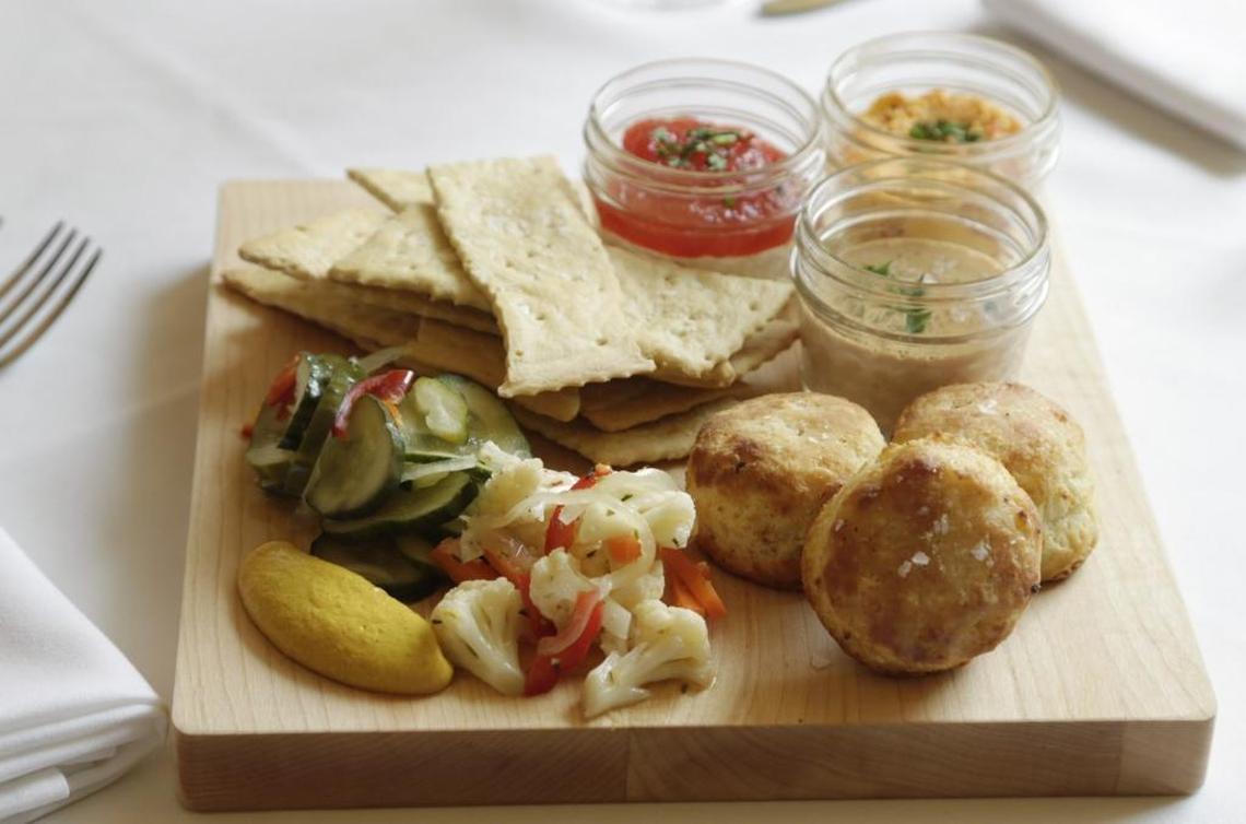 An original menu included a sharable item named ‘In Jars’ includes pimento cheese, pepper jam, chicken liver mousse, house-made saltines, buttermilk biscuits and pickled vegetables, reminiscent of a Southern picnic.