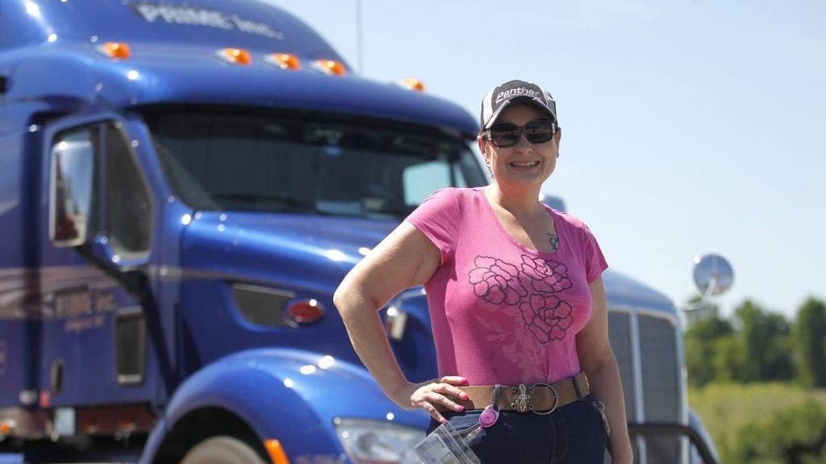 Deborah Tucker, who has been driving trucks since April, posed outside a Pilot fuel station on Cherry Blossom Way in Georgetown on June 27. She wanted to spend more time with her trucker husband, so she went to driving school in February. “I love it. It doesn’t feel like a job.”