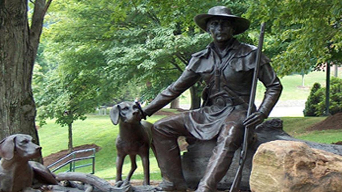 Daniel Boone and his dogs in a bronze statue at Appalachian State University in Boone, N.C.