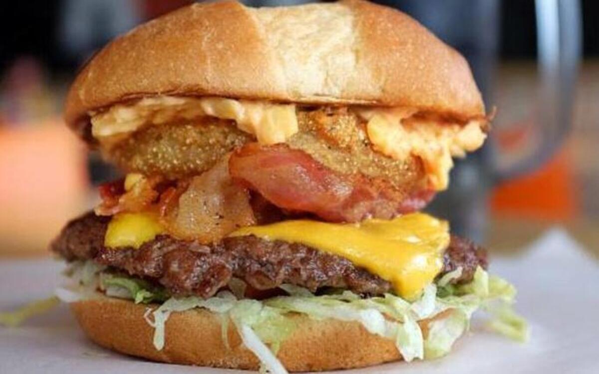 A&W wants to give a $100 gift card to the person who names this towering burger, which has pimento cheese, American cheese, a fried green tomato, a regular red tomato, lettuce, special sauce and, of course, beef.