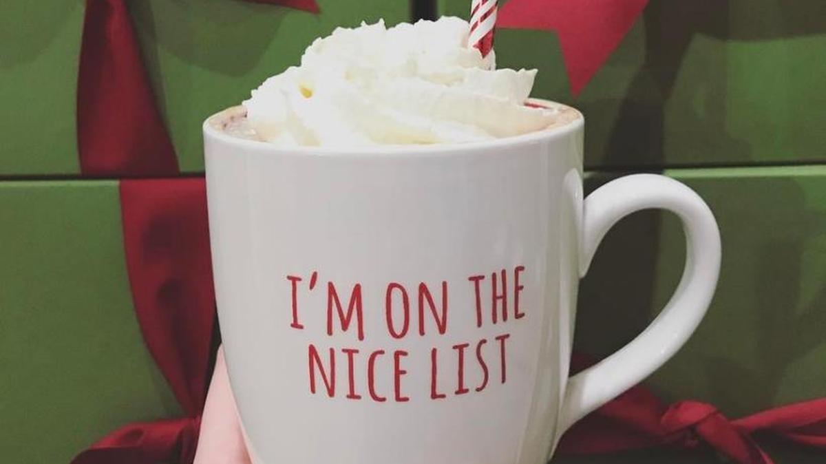 A peppermint white moka in a holiday mug. The mug is $9.95 at Coffee Times.
