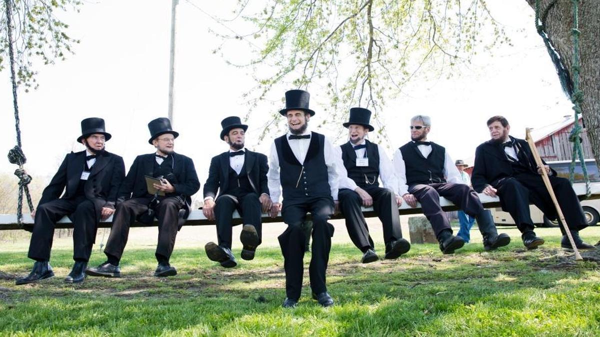 From left, Ted Bruzas of Avon, Ill.; John Cooper of Pickerington, Ohio; Ron Carley of Detroit; Kevin Wood of Oak Park, Ill.; Robert Brugler of Worthington, Ohio; Rick Miller of Cranberry Township, Maine; and Stan Wernz of Cincinnati sat on a giant swing at the Pate House in Lewisport, Ky., in April 2016.