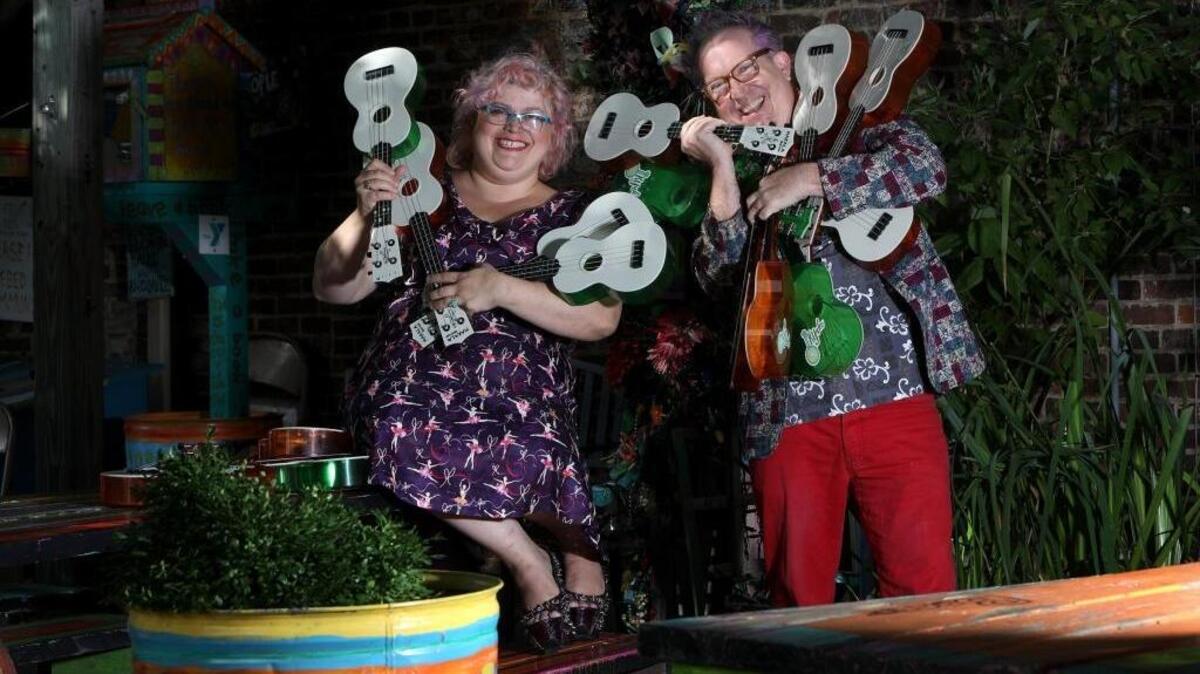 Plum Brownrobie and Mick Jeffries with ukeleles at Third Street Stuff in advance of the first KyUke Fest, Sept. 16 and 17 in Lexington.
