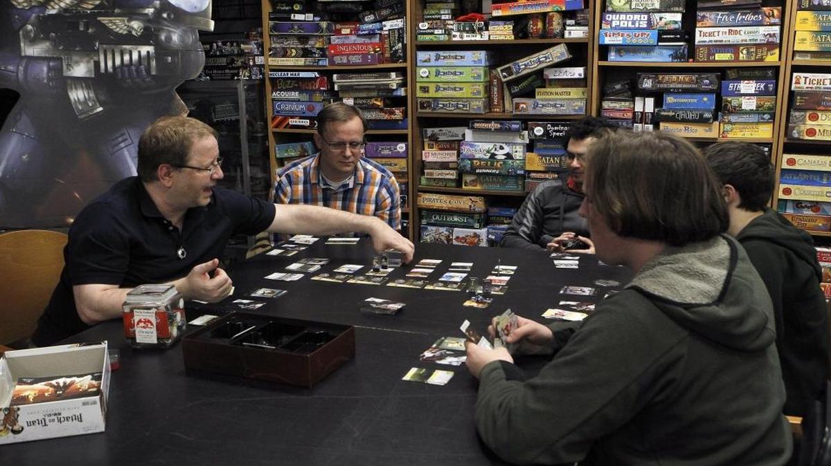 Daryl Janisch, left, and others played Attack On Titan at The Rusty Scabbard on Lane Allen Road in Lexington.
