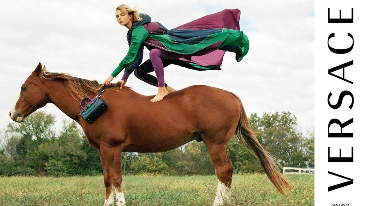 Model Edie Campbell atop a horse wearing Versace. The photo is part of the Versace Spring/Summer 2017 ad campaign shot in Kentucky by Bruce Weber.