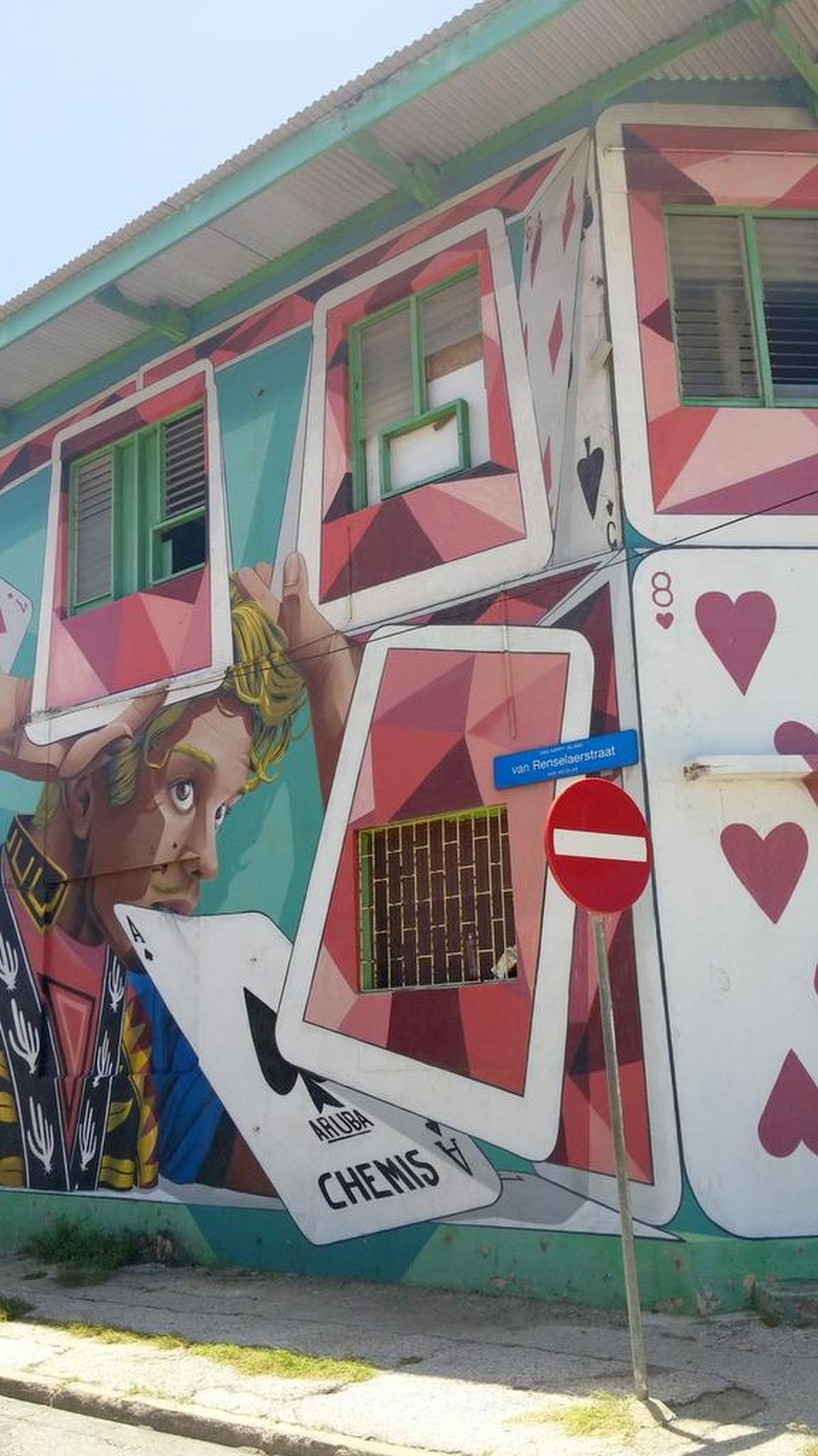 Caption Colorful murals adorn buildings in Aruba's San Nicolas District.