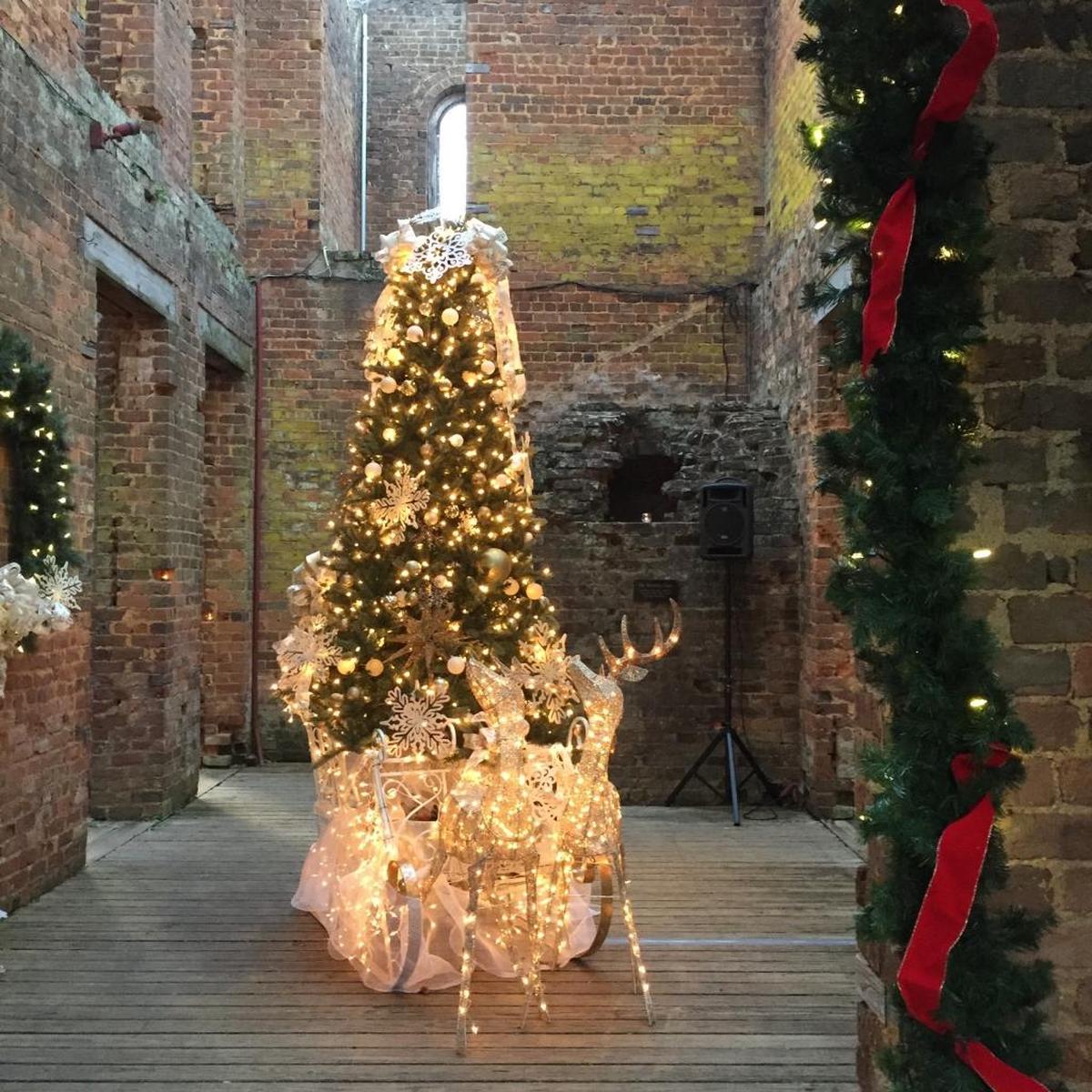 An elaborate holiday display welcomes guests to the ruins at Woodlands.