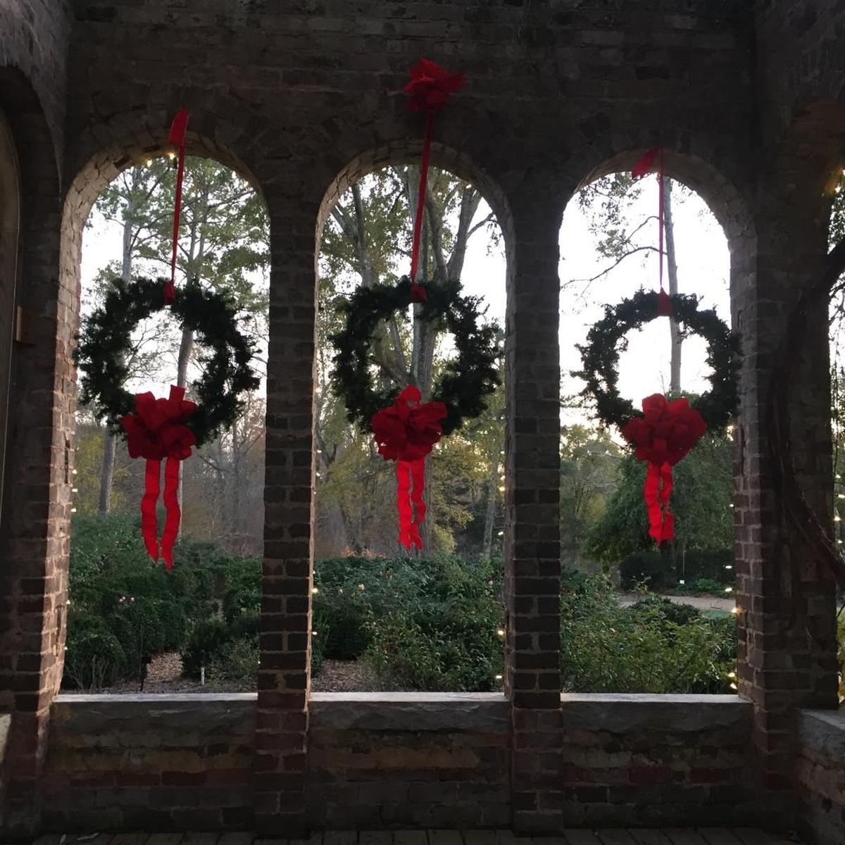 Holiday wreaths hang from the windows of the Woodlands ruins.