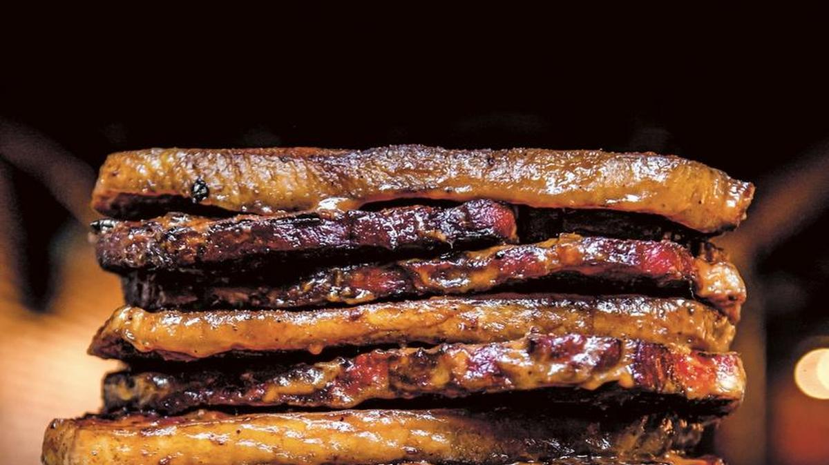 These caramelized Midwest pork steaks can be smoked for a day or two in advance and finished on the grill just before serving. You can find the recipe in “Praise the Lard.”