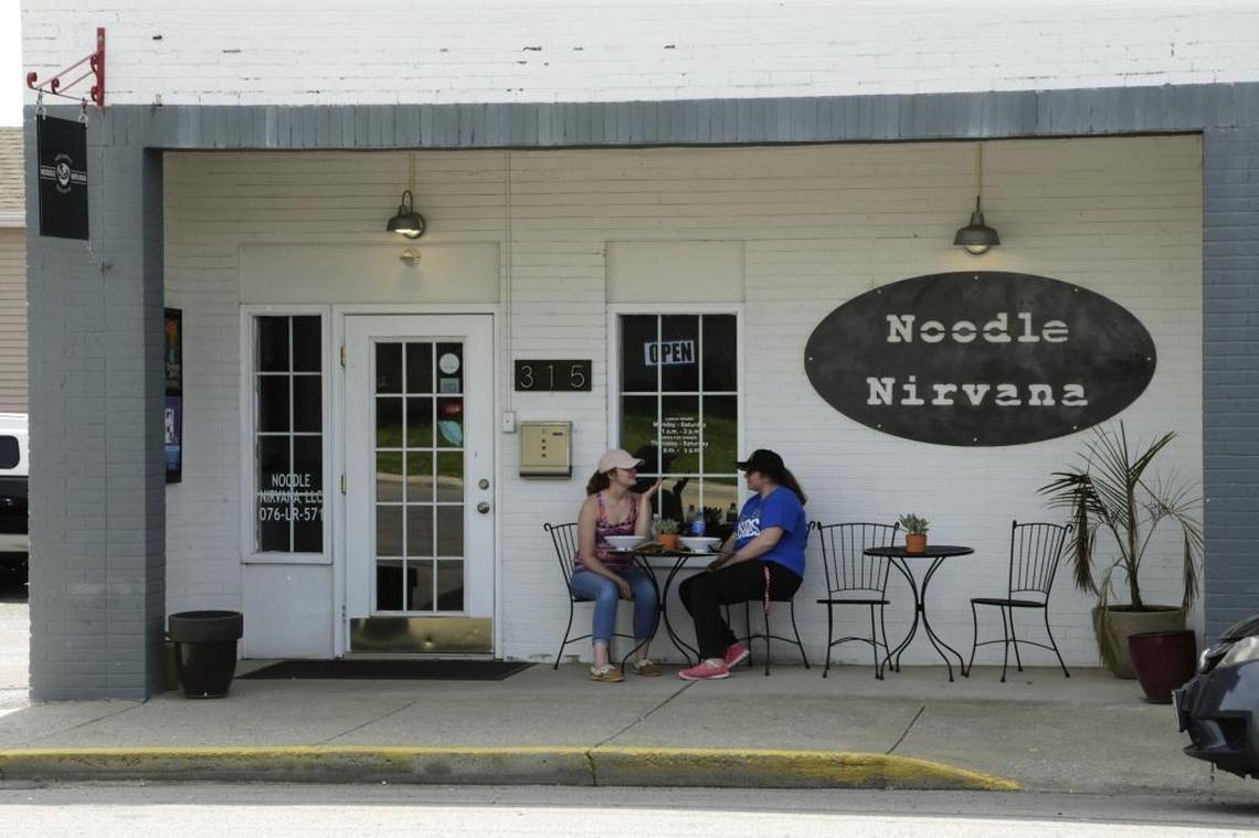 Haley Denney, left, and Brittany LaBelle ate their noodles in the outdoor seating area at Noodle Nirvana in 2017.