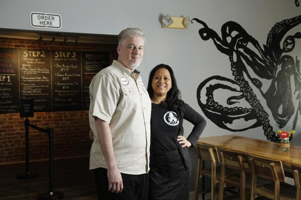 Owners Adam Mullikin and Mae Suramek in a dining area of Noodle Nirvana in Berea.
