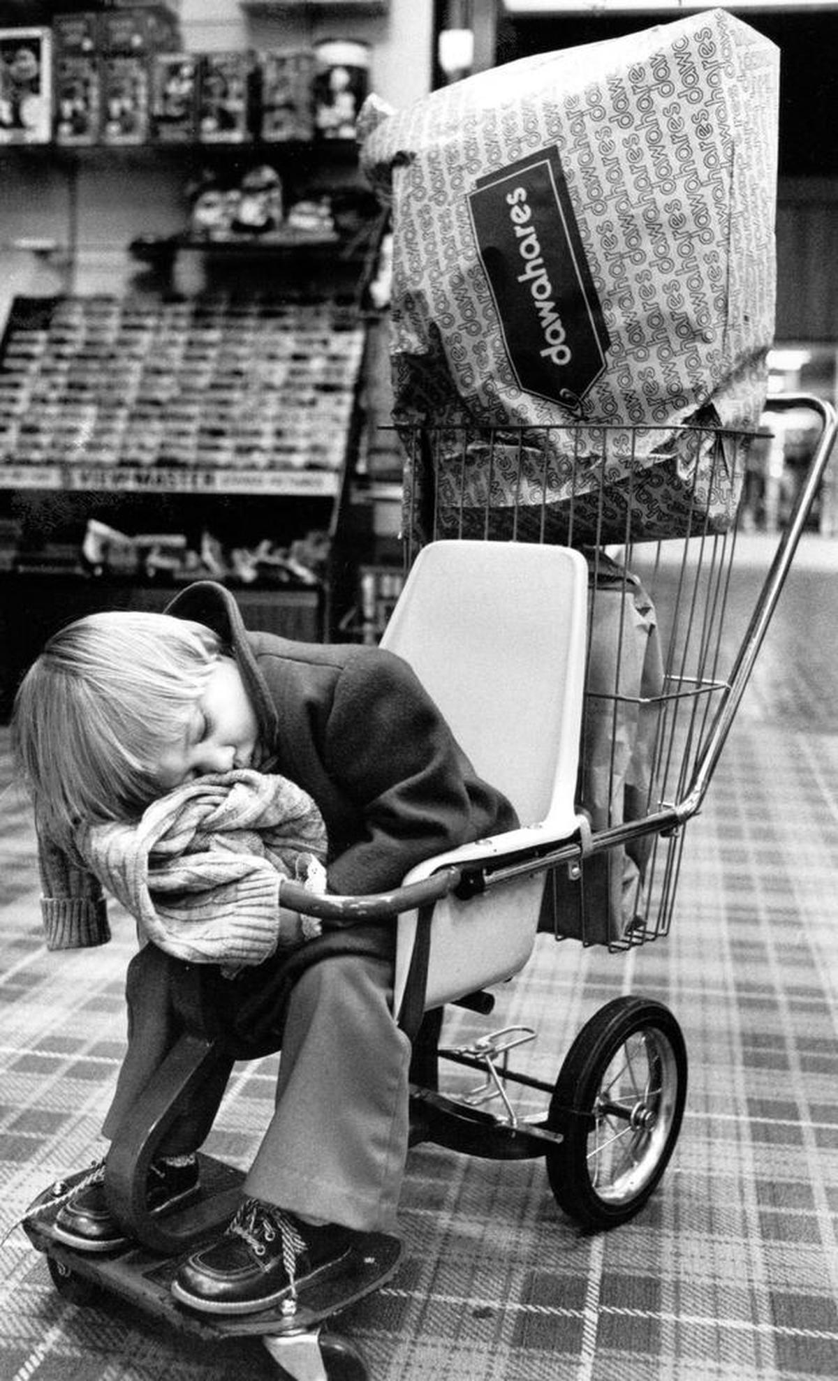 Two-year-old Stephanie Danielle Cole, from McKee, slept while her mother did some Christmas shopping Dec. 19, 1979, at Dawahare’s in Fayette Mall.