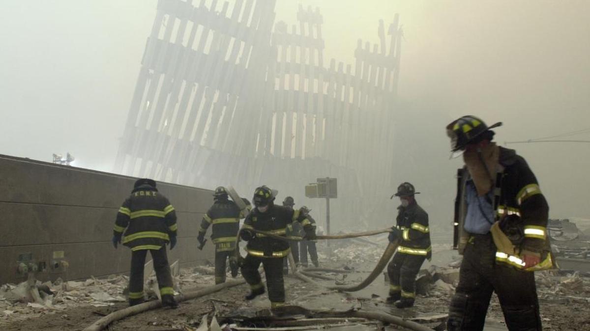 Firefighters worked beneath the destroyed mullions, the vertical struts which once faced the soaring outer walls of the World Trade Center towers, after a terrorist attack in New York in 2001. This year marks the 15th anniversary of the attack, and each year businesses roll out deals and tweets associated with the attacks, and each year they face a tidal wave of backlash and outrage in response.