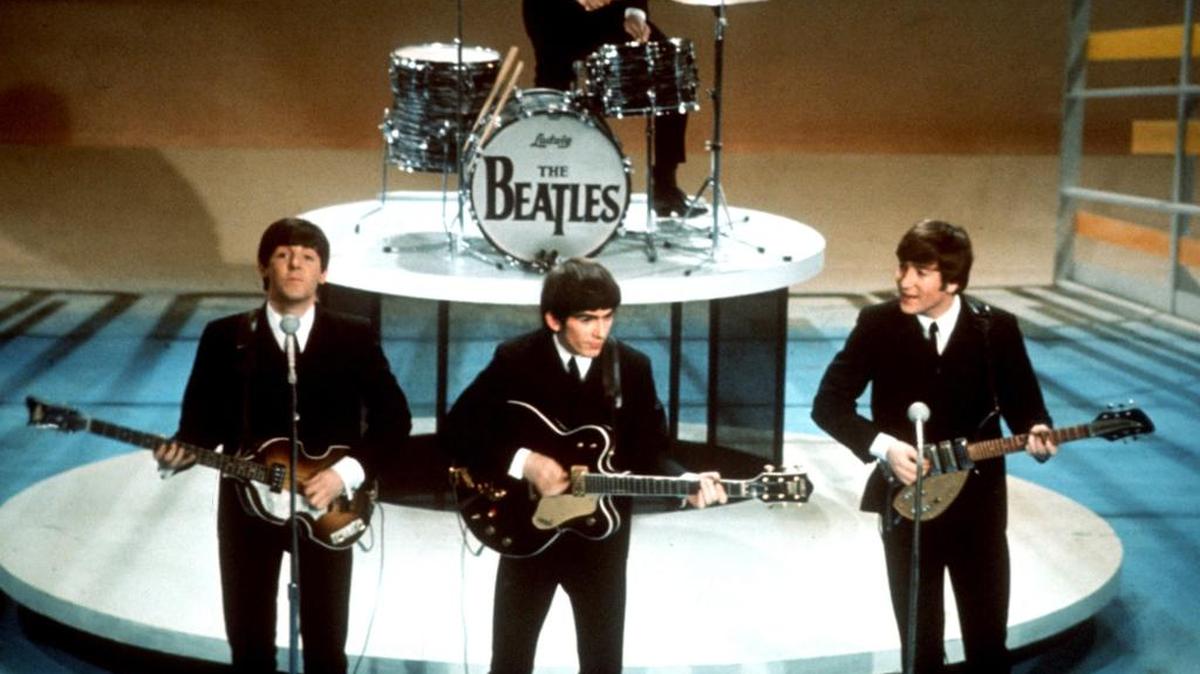 The Beatles, shown performing on the Ed Sullivan Show Feb. 9, 1964, will finally have their music available on streaming services such as Spotify and Apple Music at 12:01 a.m. local time on Dec. 24, 2015.