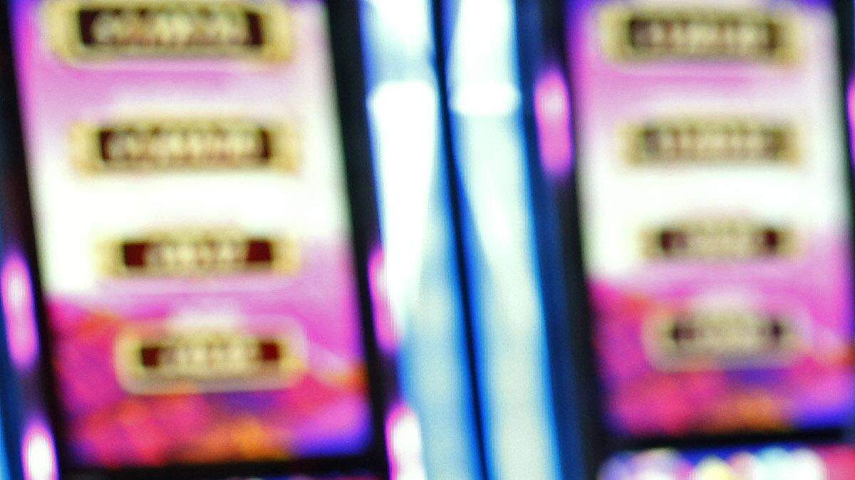 In this Sept. 24, 2015, photo, JoAnne Santelli, left, and Beverly Aus played gaming machines at the Downtown Grand hotel and casino in Las Vegas. As gamblers move away from traditional slot machines, game-makers and casinos are looking at new ways to keep people playing. 