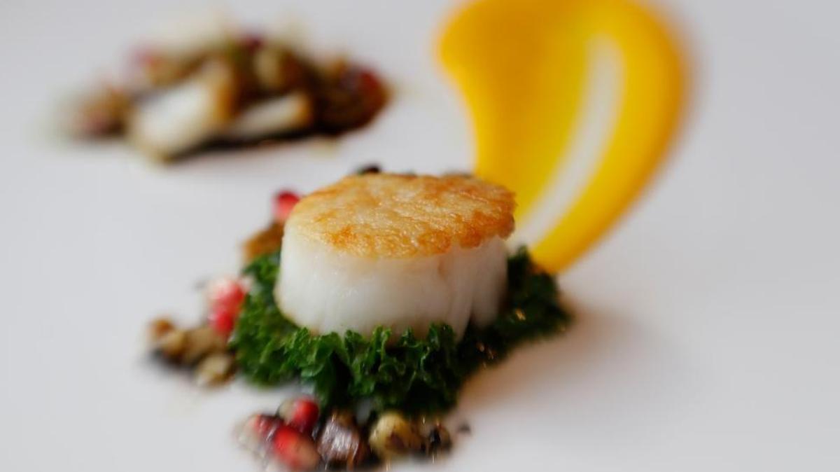 Dudley's Chef Mark Richardson made this scallop dish with black walnuts in this 2016 file photo.