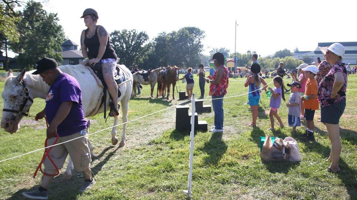 Horse lovers of all ages gathered at the Kentucky Horse Park to celebrate Hat's Off Day and learn about all about horses on Saturday, July 25, 2015.