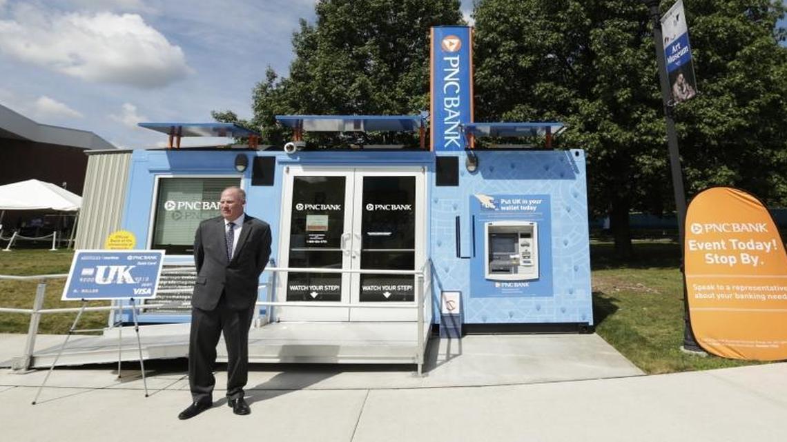 John Gohmann, PNC regional president of Lexington, welcomed visitors during an open house for PNC’s new tiny branch on the University of Kentucky campus in Lexington on Monday. The 160-square-foot branch is housed in a former shipping container and sits in front of the Bowman’s Den facing Avenue of Champions. A permanent location will open in the new student center in 2018.