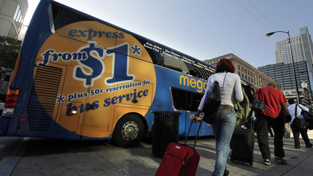 People wait to board a Megabus on South Canal Street in Chicago, Illinois,August 27, 2012. Megabus is an intercity bus service. (Terrence Antonio James/Chicago Tribune/MCT)