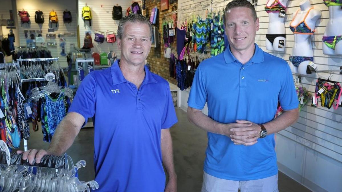 Rick Pannell, left, recently sold the Pannell Swim Shop he started 30 years ago to Tom Viney.