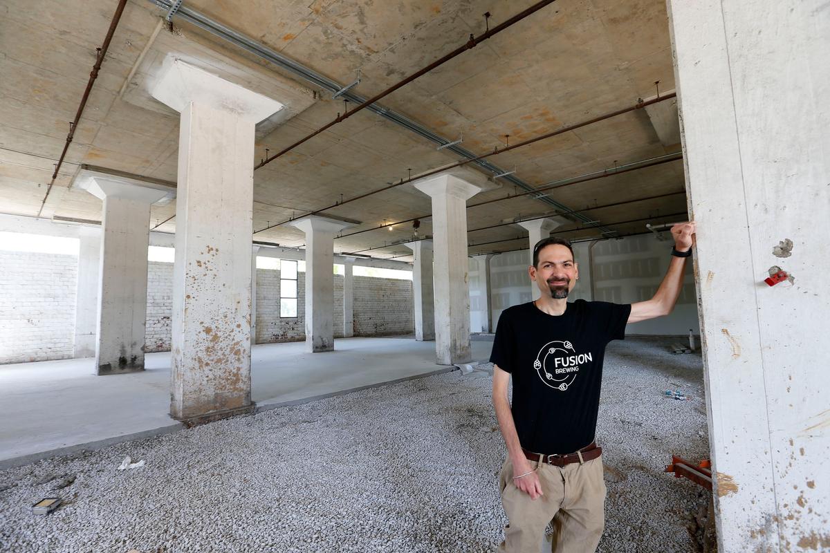 Shown in a 2018 photo, Christian Paumi, an EKU chemistry professor, opened Fusion Brewery on the ground floor of the Pepper campus rickhouse in the Distillery District on Manchester Street.