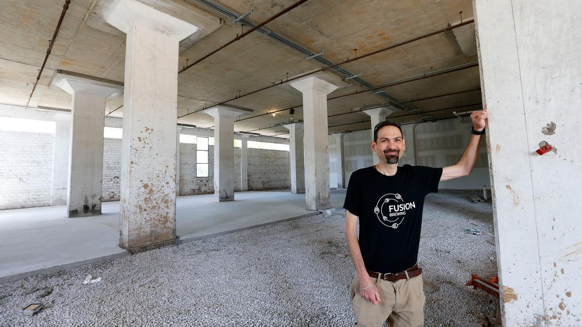 Christian Paumi, an EKU chemistry professor, is opening Fusion Brewery on the ground floor of the Pepper campus rick house in the Distillery District on Manchester Street. The area in the background will be the bar, seating area, and the brewing area.