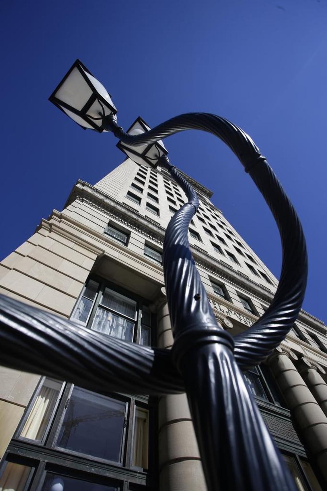 Totally in Love, a permanent sculpture of two intertwined lamp posts, sits outside 21c Museum Hotel in downtown Lexington.