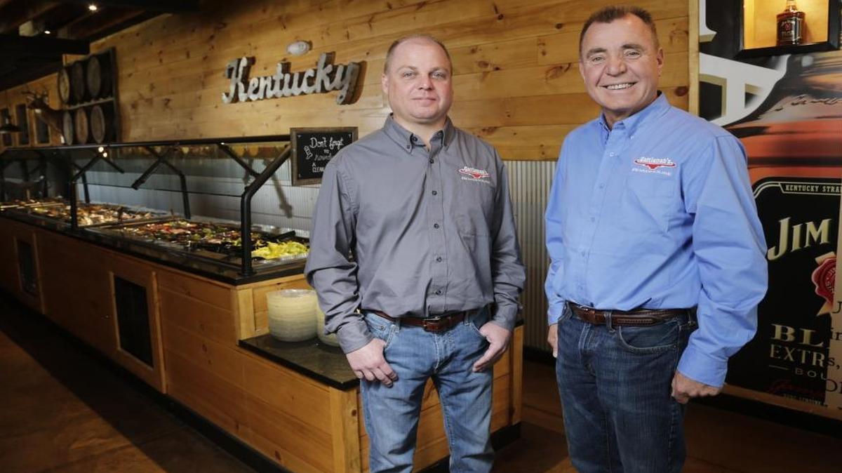 Stuart Meredith, left, and Bill Hisle, co-owners of Cattleman’s Roadhouse, at their Georgetown restaurant.