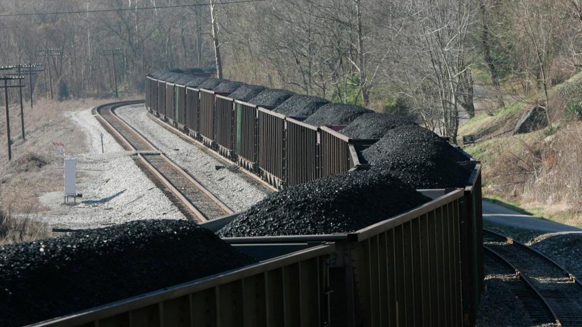 A coal train moved by houses on Typo Tunnel Lane in Typo in December 2006. Typo is a former coal camp located off Ky. Highway 15 a few miles north of Hazard. Thousands of coal jobs have been lost in Eastern Kentucky in recent years.