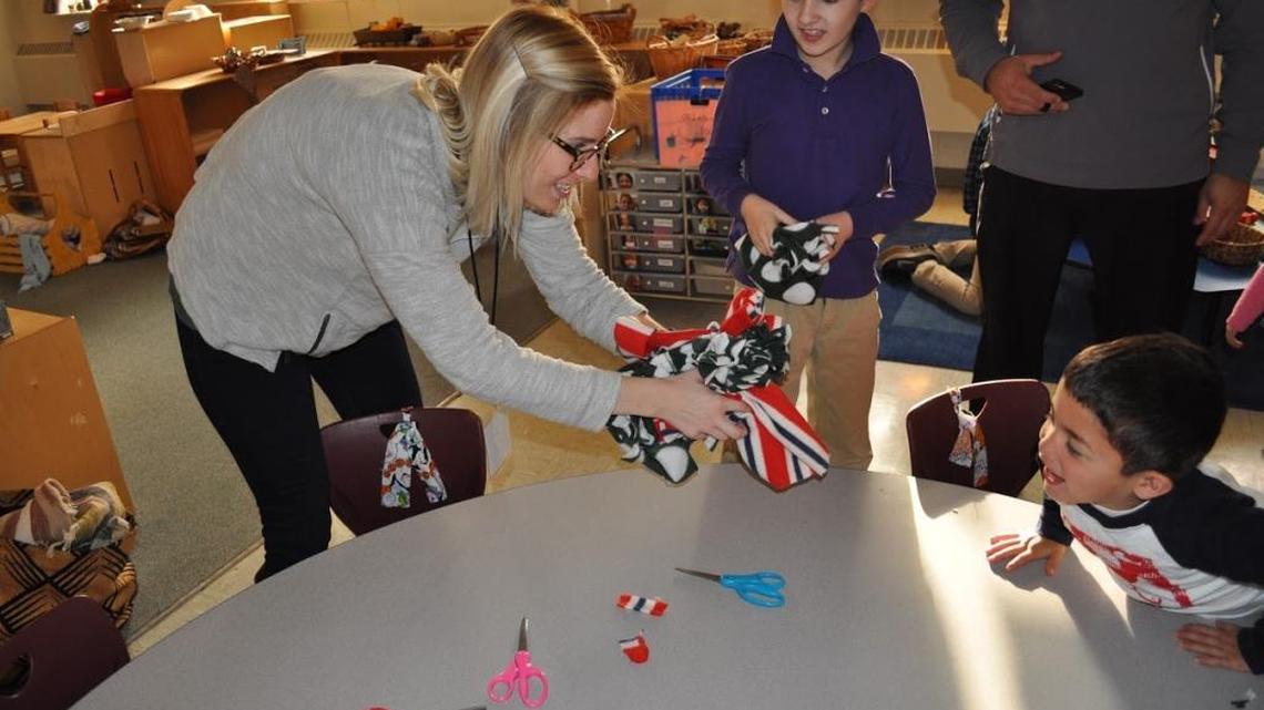 Dana Lea accepted felt hats made by Sayer Lower School pre-kindergarten students paired with their third-grade buddies in 2016.