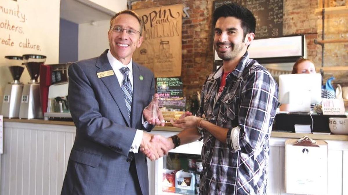 Salvador Sanchez, right, owner of A Cup of Common Wealth, accepted the Minority Business category award from Forcht Bank’s Tucker Ballinger.