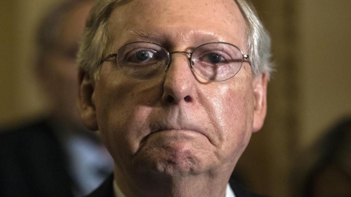 Senate Majority Leader Mitch McConnell, R-Ky., tells reporters in Washington on June 27 that he is delaying a vote on the Republican health care bill.