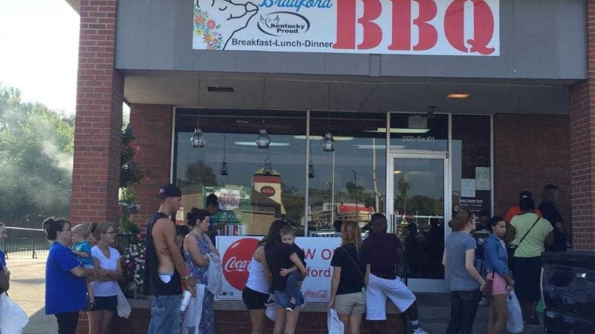 Customers lined up at Bradford BBQ in Zandale in 2015. The restaurant opened in May 2015 after building a following as a food truck for five years. The Bradfords are moving to Garrard County and will close the Zandale restaurant after Saturday’s UK-Louisville football game.