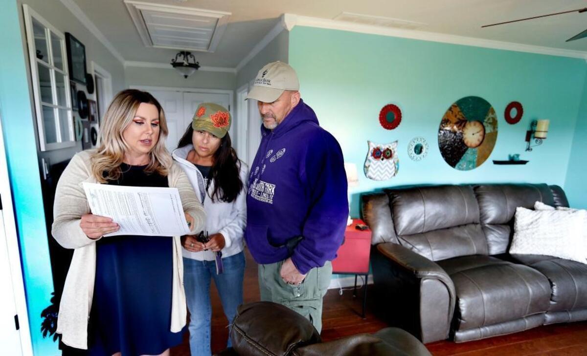 Realtor Amanda Stepp Marcum, left, showed a house she has listed at 323 Herndon Lane in Berea to Brad and Anita Winkler. The housing market in Lexington and Central Kentucky has a tight supply of houses.