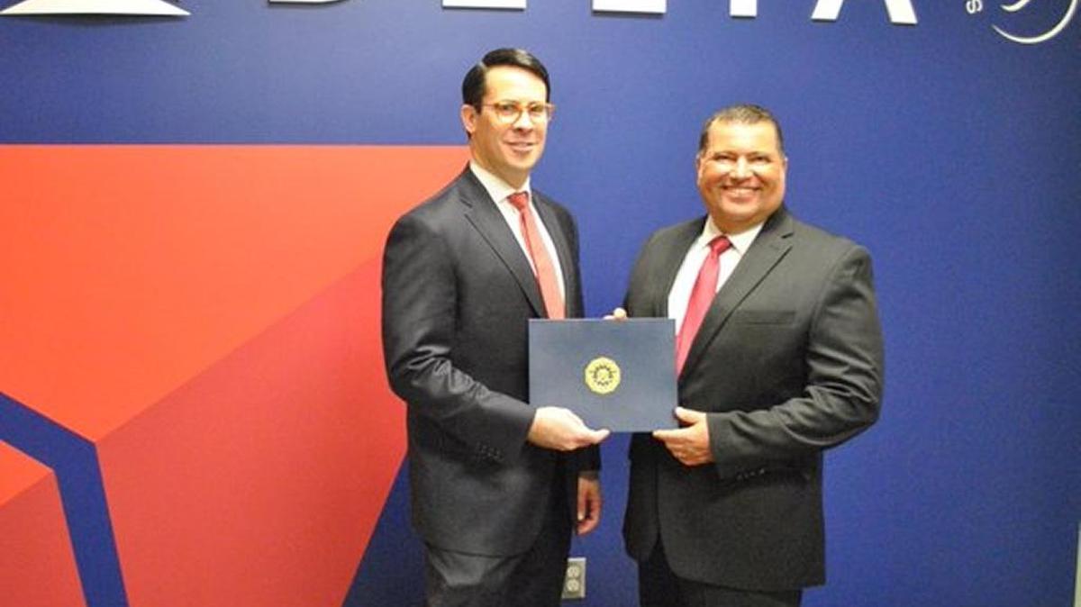 Howard Marshall, left, special agent of the FBI Louisville Division, presented Kentucky Human Rights Commissioner Robert Asseo with the Louisville Division FBI Director’s Community Leadership Award for 2015 at the Cincinnati/Northern Kentucky International Airport in Covington on Feb. 29.