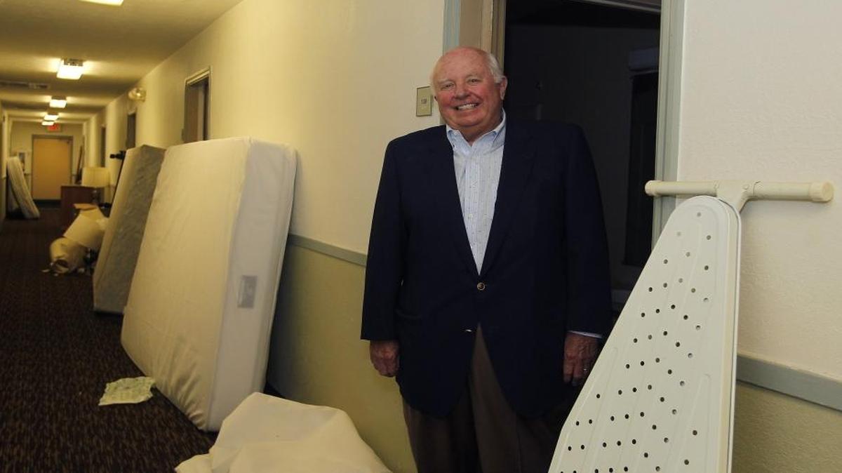 Buddy Cowgill in the hallway of the property at 2750 Gribbin Drive, the original location of the StudioPlus chain he founded. He plans to transform it from a run-down hotel to apartments.