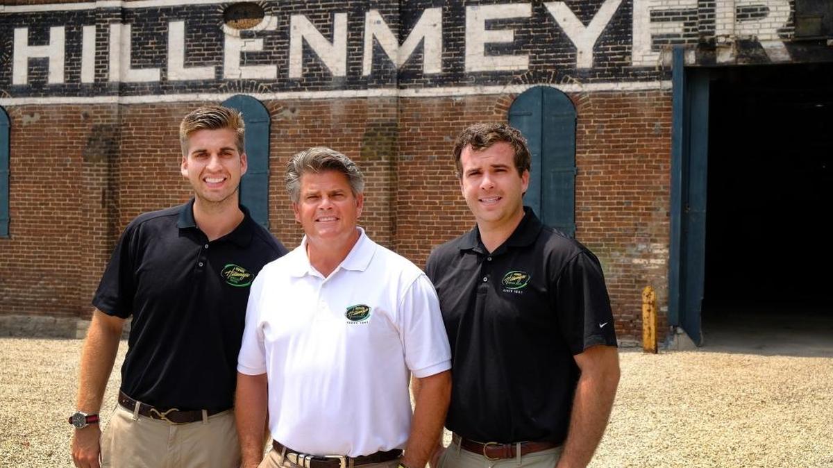 Stephen Hillenmeyer, center, with sons Seth, left, and Chase, outside the family's former nursery warehouse, which originally was an early 1800s cotton mill. Hillenmeyer’s no longer owns the property, but the company is now headquartered across Sandersville Road from it.
