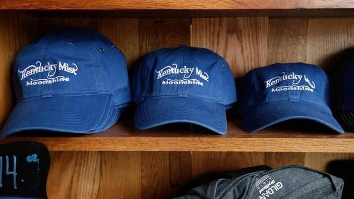 Caps were for sale at the Kentucky Mist moonshine distillery in Whitesburg last year. Photo by Pablo Alcala | Staff