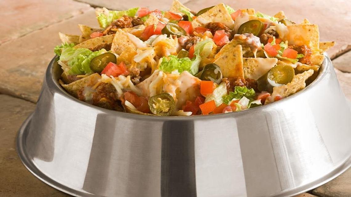 One of the signature items at Double Dogs is Bo’s Dog Bowl Nachos, made with homemade chili, Italian sausage, beans, cheeses, and more. Other appetizers included “pickled paw prints,” which are fried dill pickle chips. More traditional fare, including wings, pizza, sandwiches, burgers and hot dogs also is available.