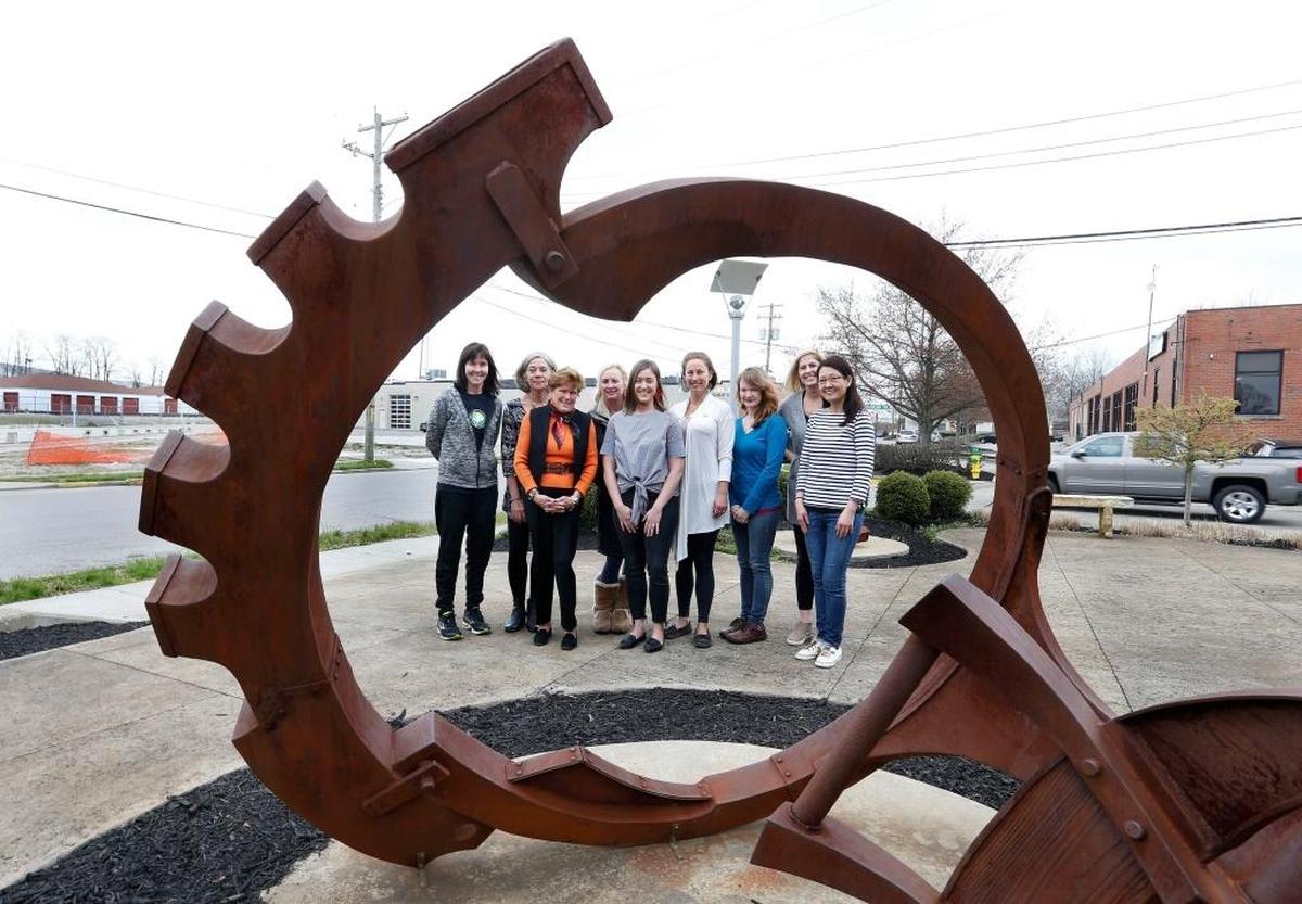 Some of the Warehouse Block female business owners posed in the sculpture garden on National Avenue. From left: Sheila Kalas, owner of Fitness Plus; Teresa Hendricks, owner of Lucia’s World Emporium; Page Etchison, owner of Etchison Co. flower shop; Jane Buckner, owner of Rag Peddler Fabrics; Clare Henson, owner of Market on National; Lauren Higdon, owner of centered; Emily Miller of Latitude Arts art studio; Kelli Gabart, owner of Wildfire Yoga; and Sylviana Herrin, owner of La Petite Delicat.