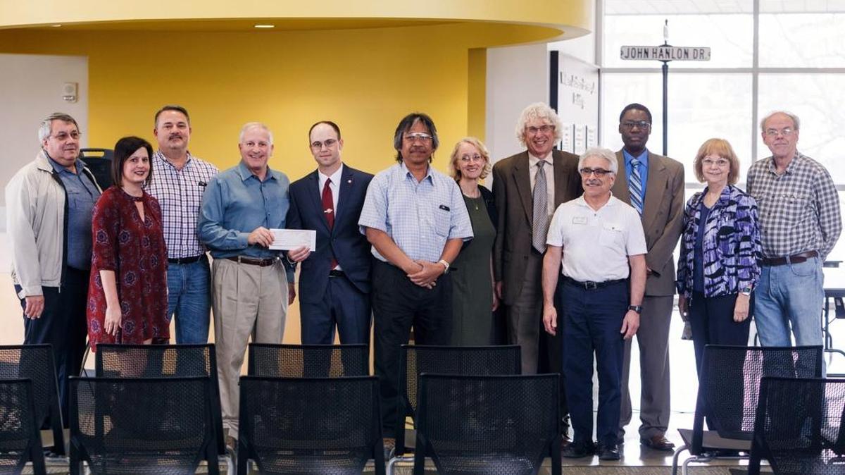 From left, Robert Barr, Kentucky Science and Engineering Fair president; Heather Grant, Battelle CPRP coordinator and Eastern Kentucky University graduate; Steve Downing, Batelle laboratory manager; Mark Needham, Battelle site manager at Blue Grass Chemical Agent Destruction Pilot Plant; Jason Marion, EKU, associate professor and fair co-director; Lindy Dejarme, Battelle senior chemist; June Settle, EKU, grants and research specialist and fair co-director; Jerry Pogatshnik, dean of EKU Graduate School and associate vice president for research; Paul Rosile, EKU, associate professor and KY-SEF board member; Tom Otieno, dean of EKU College of Science; Deborah Whitehouse, dean of EKU College of Health Sciences; Martin Brock, EKU, associate professor and KY-SEF board member.